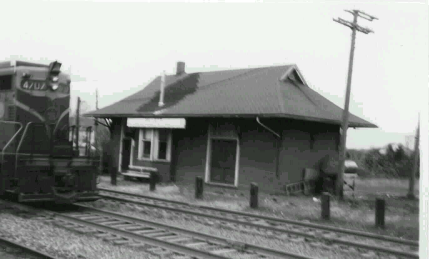 Grand Trunk Western GP18 #4707 leads an eastbound extra freight past the Millett Depot in 1961.