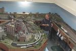 View of the west end of the layout showing the city of Summit in the center foreground, Millett and Summit Junction behind and to the left, and Anderson to the right.  The wired cabs have since been replced with wireless NCE DCC throttles.